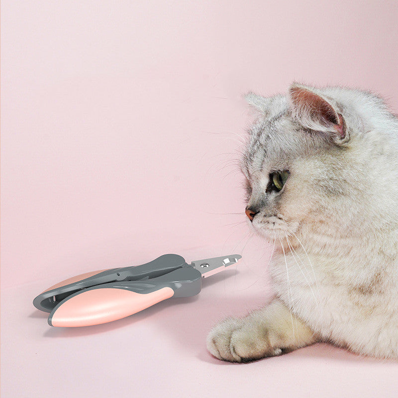 Grey cat next to the pink Furly nail clipper